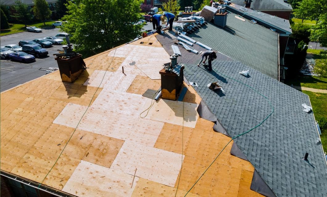 Workers Applying Shingles to Roof | Roof Replacements